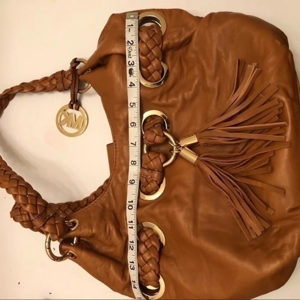 Michael kors brown leather grommet tassel bag